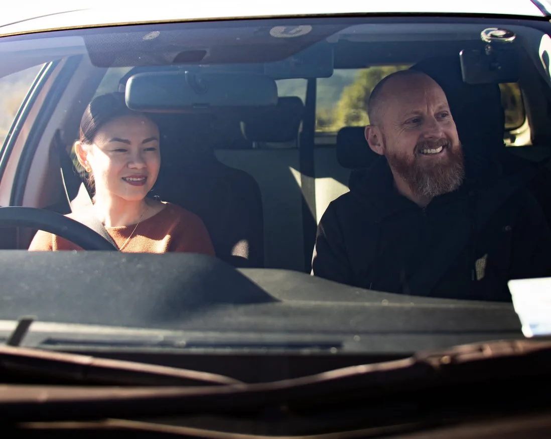 Me and a student in my car, mid-lesson, smiling.
