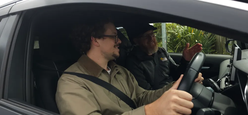 Marcel explaining driving concepts to a student.